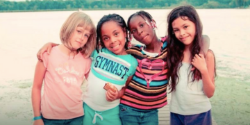 Group of girls smiling at a Salvation Army summer camp