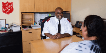 A Salvation Army Officer assisting a client