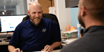 A Salvation Army worker helping a client