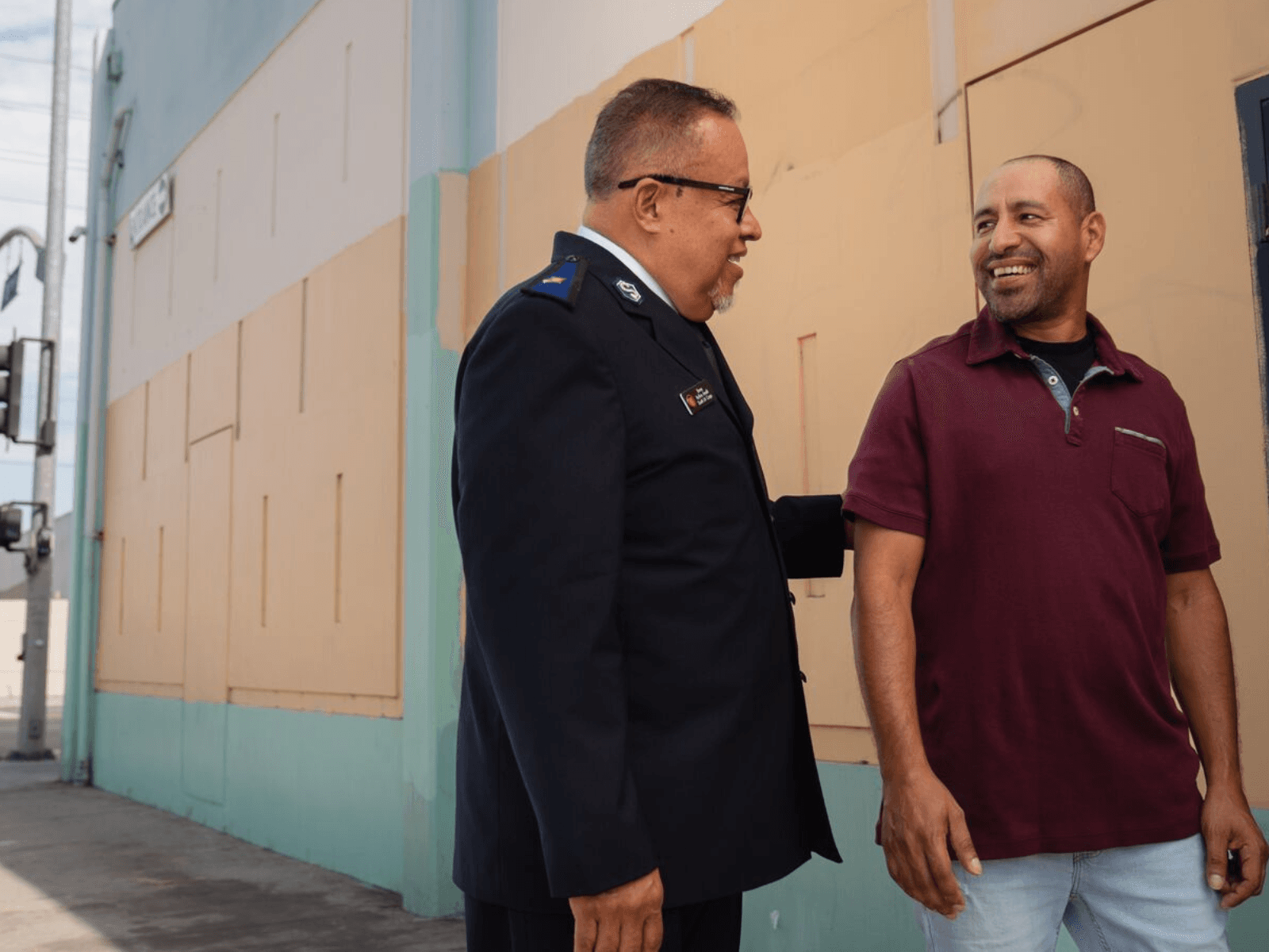 Salvation Army Officer talking with a man
